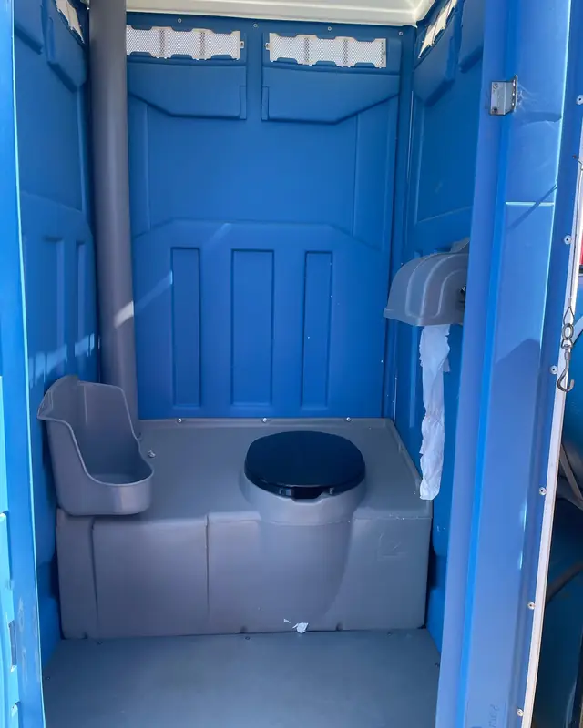 Inside a standard porta potty
